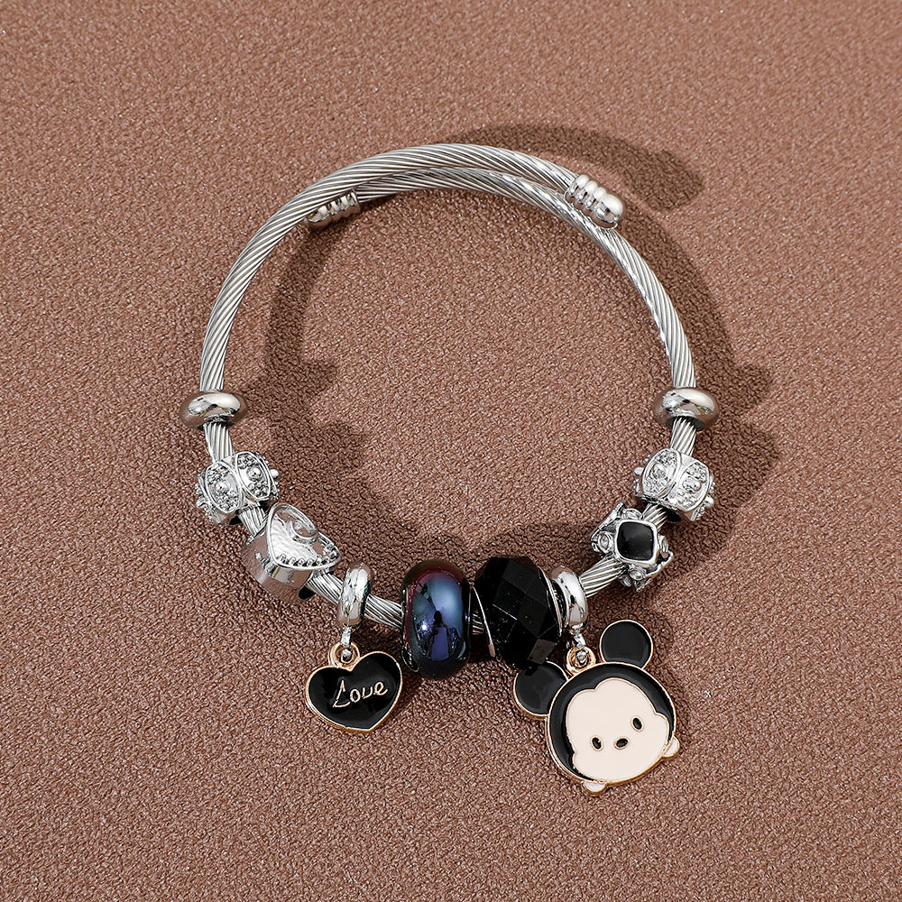 标题 Minnie Mouse Themed Gold - Plated and Silver - Plated Charm Bracelet: A Dash of Disney Elegance