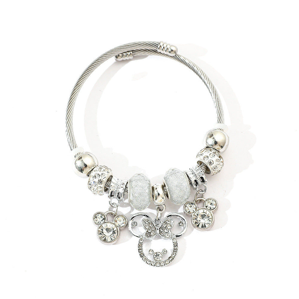 标题 Minnie Mouse Themed Gold - Plated and Silver - Plated Charm Bracelet: A Dash of Disney Elegance