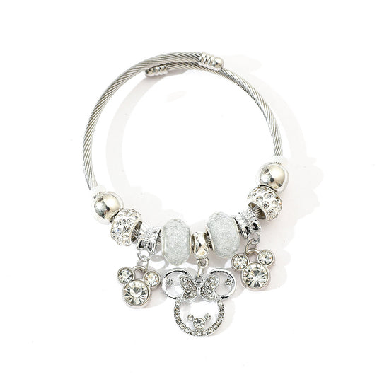 标题 Minnie Mouse Themed Gold - Plated and Silver - Plated Charm Bracelet: A Dash of Disney Elegance