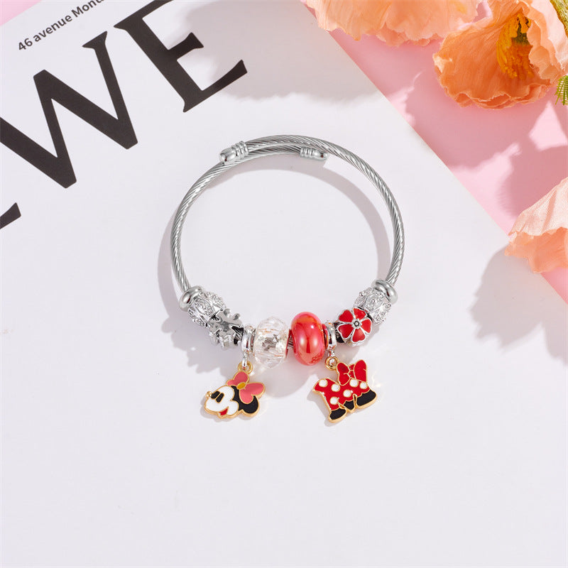 标题 Minnie Mouse Themed Gold - Plated and Silver - Plated Charm Bracelet: A Dash of Disney Elegance